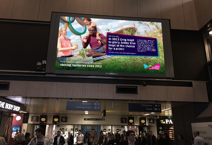 Euston tickethall with QEOP advertising